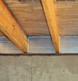 SilverGlo™ insulation installed in a floor joist in Uvalde