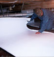 Del Rio insulation being installed in a crawl space.