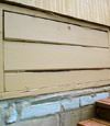 an old-fashioned crawl space door in Hondo about to be replaced