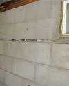 Severely buckling foundation walls in a home in Canyon Lake in need of repairs.