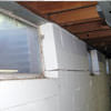 A foundation showing severe inward buckling along the windows in a Schertz home.
