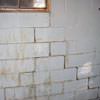 A cracked foundation wall near a window in a Pearsall home