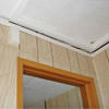 The ceiling and wall separating as the wall sinks with the slab floor in a Lockhart home