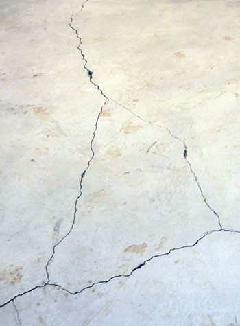 severely cracked, heaving slab floors in a home in Devine