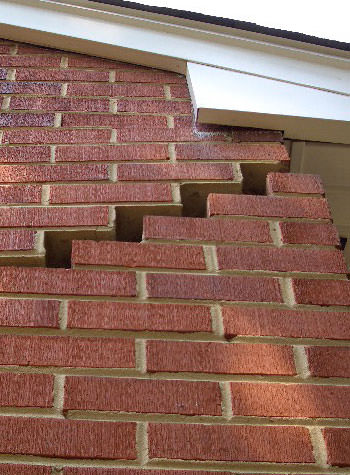 photo of a rotating foundation wall with cracks in Monte Vista