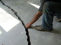 a severely damaged cracked concrete slab floor in Pleasanton