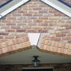 Major tuckpointing on a home archway over a door, with tuckpointing several inches wide that has failed on a San Antonio home