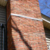 A tilting chimney on a Bulverde home with a leaning, tilting chimney that was temporarily repaired.