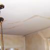 Drywall cracks in New Braunfels that were poorly patched and repaired.