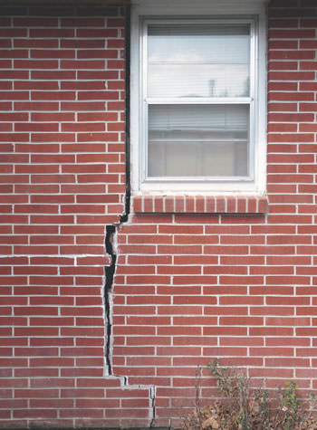 severe foundation wall cracks along a window in Pearsall