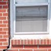A gap in a window along the outer wall due to foundation settlement of a Universal City home.
