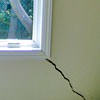 A long, diagonal crack that begins at a window corner of a Canyon Lake home