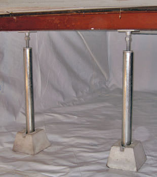 Crawl space jack posts installed in conjunction with a crawl space vapor barrier in Poteet