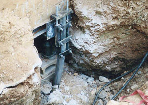 a bent, failed foundation push pier installed in Laredo.