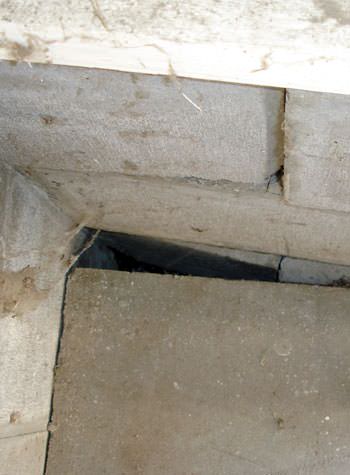 inward rotation of a foundation wall damaged by street creep in a garage in Pearsall