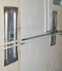 A foundation wall anchor system used to repair a basement wall in Cuero