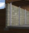 I-beam foundation wall supports installed in a Bulverde basement.