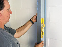 straightening the i-beam system and wall brace in Converse.