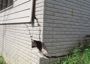 A severely damaged foundation wall in Kerrville