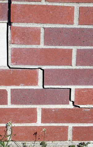 garage walls cracking due to street creep